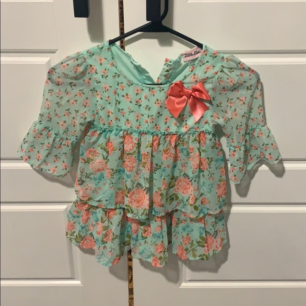 Girls size 6 shirt. 3/4 length sheer sleeves.